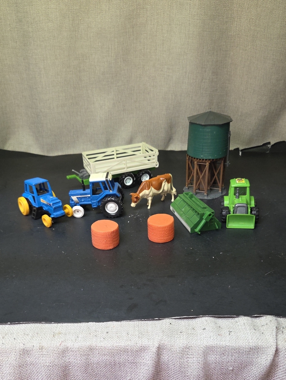 Assorted Farm Tractors, Wagon, Cow, Water Tower